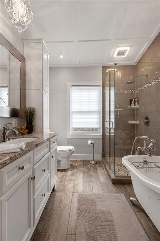 200 Orchard Street Beaver, PA 15009 - Photo 17 of 28 a bathroom with a double vanity sink a toilet a mirror and shower