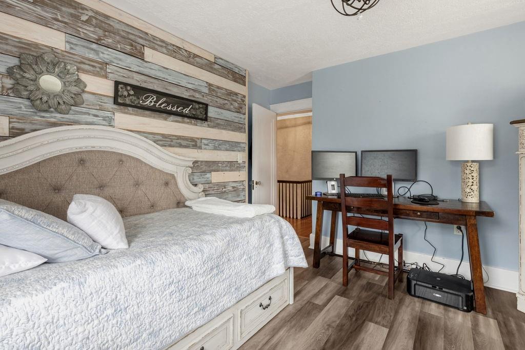 200 Orchard Street Beaver, PA 15009 - Photo 21 of 28 a bedroom with a bed and a table in it