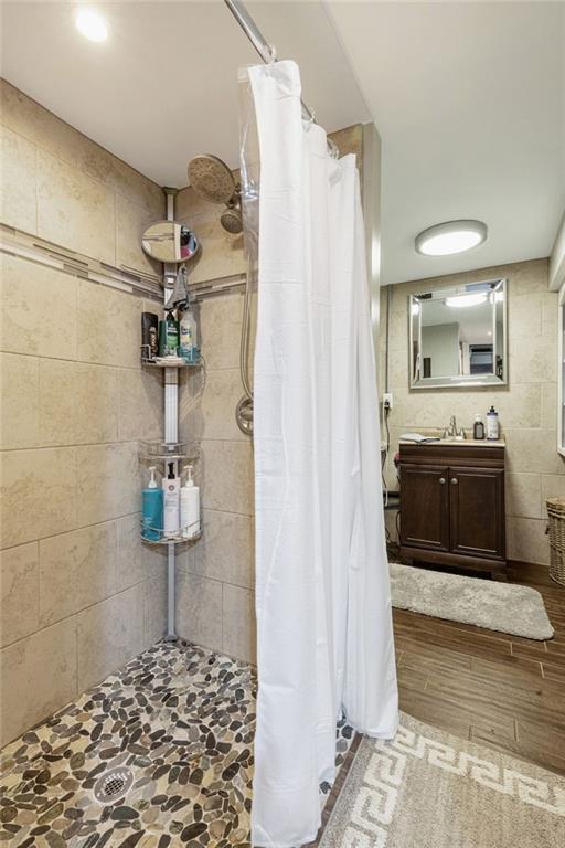 200 Orchard Street Beaver, PA 15009 - Photo 23 of 28 a bathroom with a granite countertop sink a mirror and shower