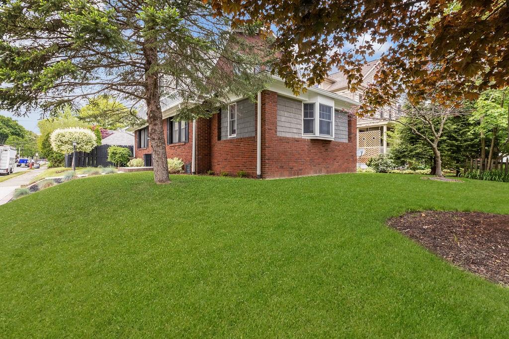 200 Orchard Street Beaver, PA 15009 - Photo 3 of 28 a front view of a house with a yard and trees