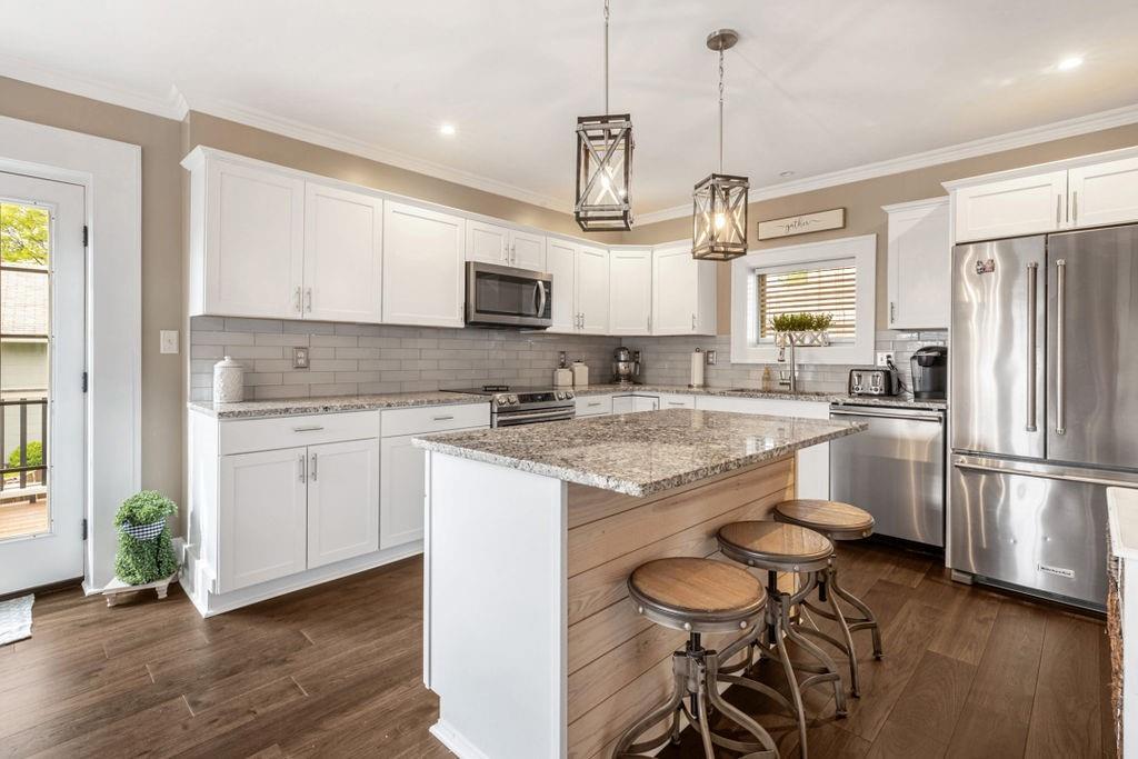 200 Orchard Street Beaver, PA 15009 - Photo 8 of 28 a kitchen with kitchen island granite countertop a center island a sink stainless steel appliances and cabinets