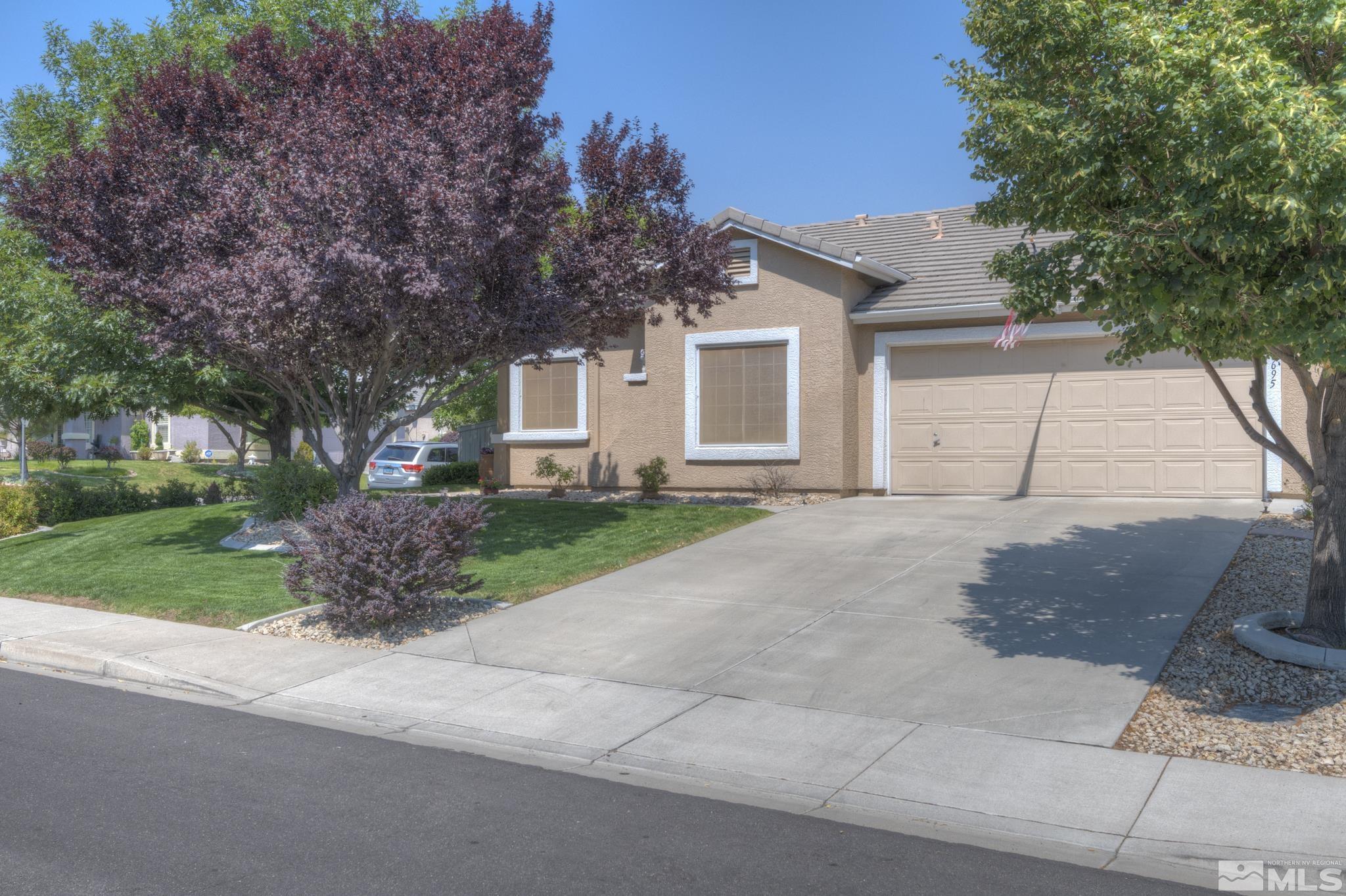 10695 Vista Bonita Lane Reno, NV 89521 - Photo 1 of 31 a front view of house with yard and green space