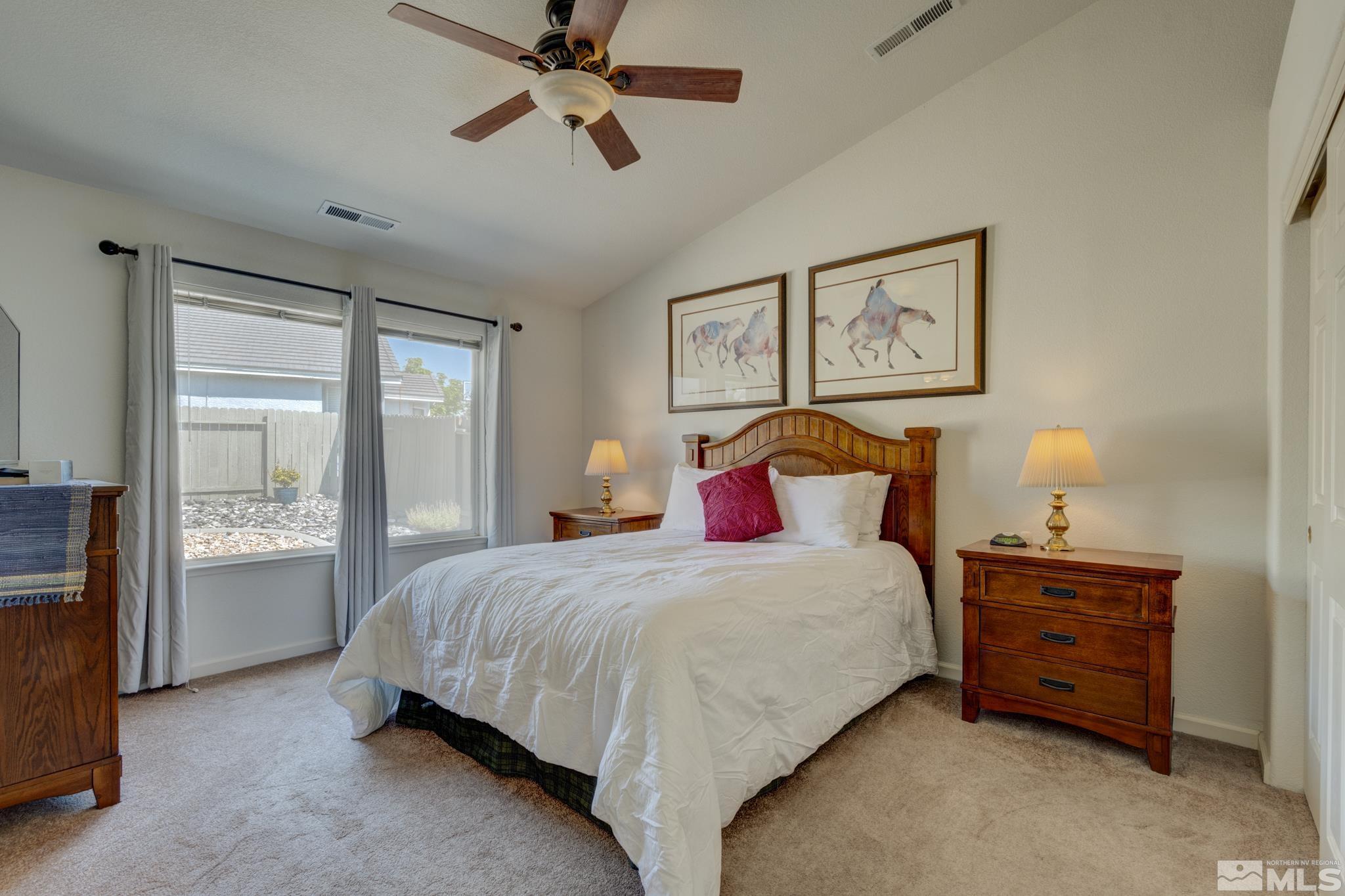 10695 Vista Bonita Lane Reno, NV 89521 - Photo 11 of 31 a bedroom with a bed and wooden floor