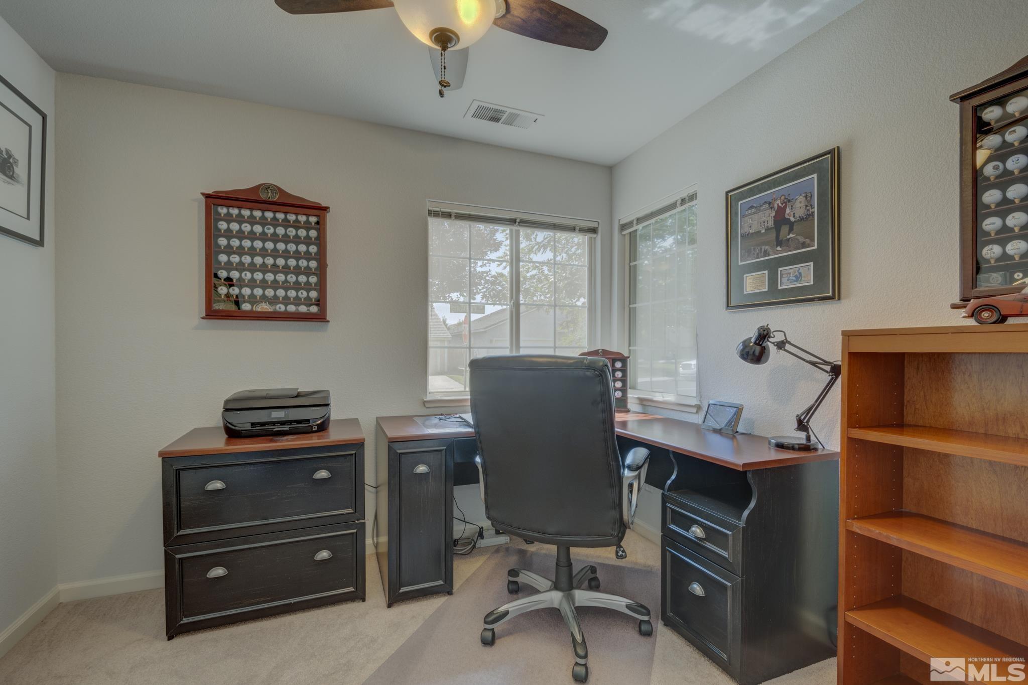 10695 Vista Bonita Lane Reno, NV 89521 - Photo 17 of 31 a view of a workspace with furniture and a window