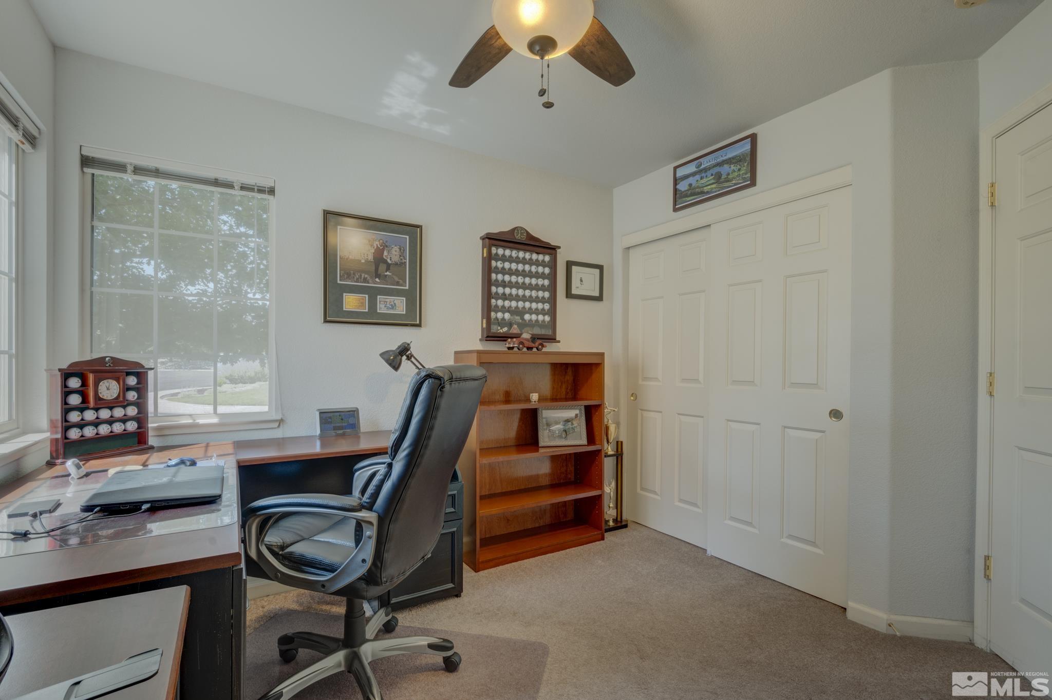 10695 Vista Bonita Lane Reno, NV 89521 - Photo 18 of 31 a view of a workspace with furniture and a ceiling fan