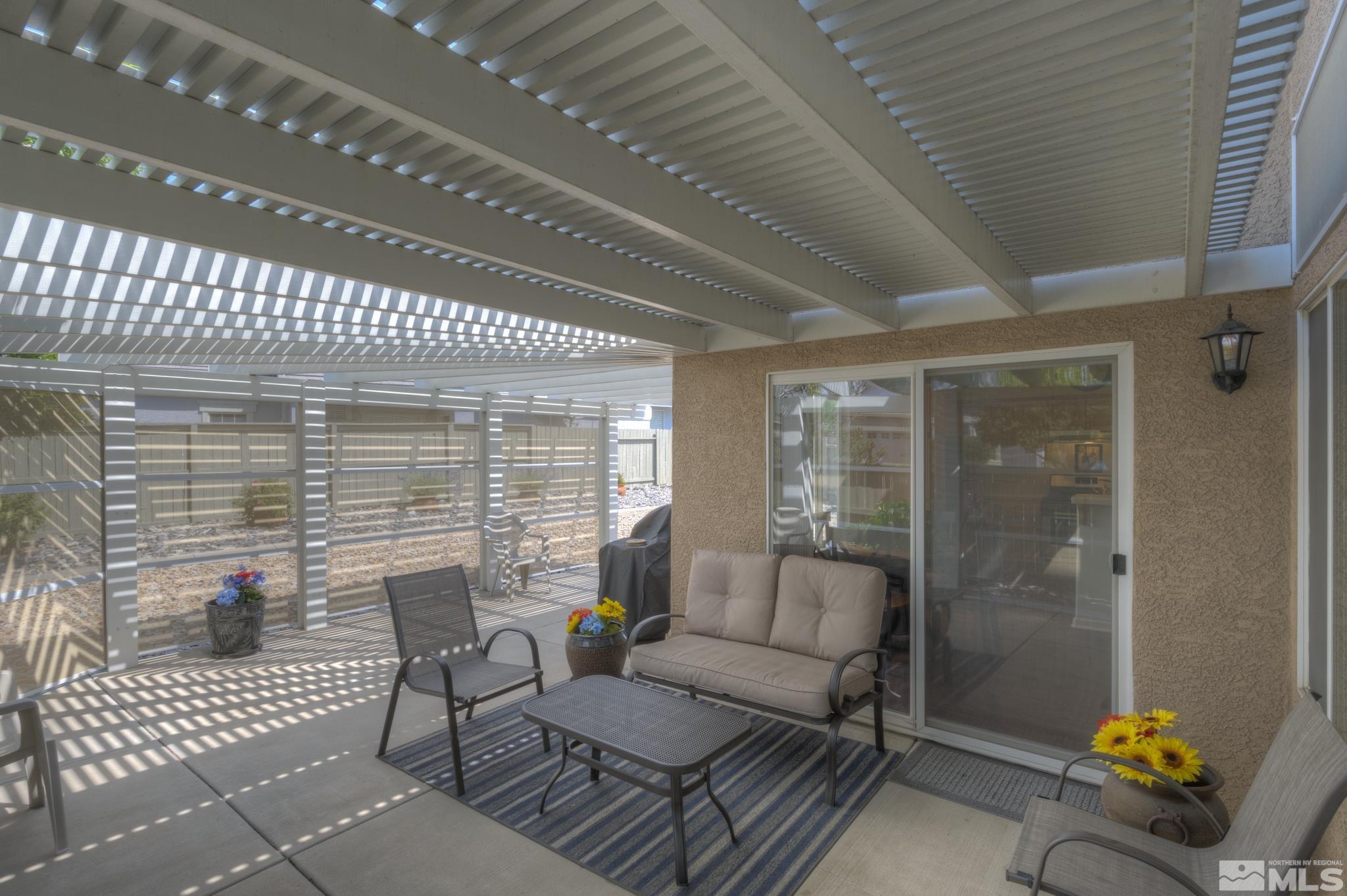 10695 Vista Bonita Lane Reno, NV 89521 - Photo 20 of 31 a building outdoor space with patio furniture