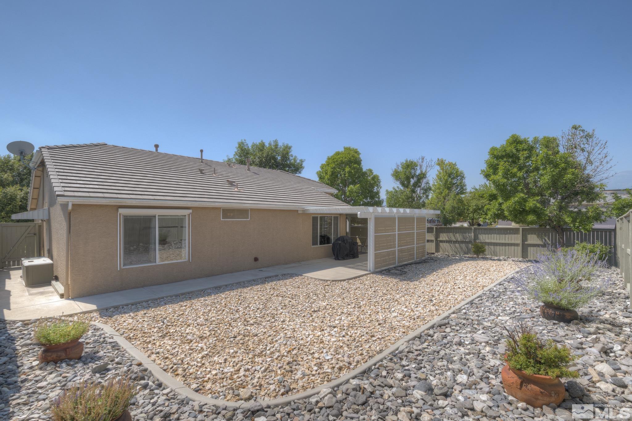 10695 Vista Bonita Lane Reno, NV 89521 - Photo 23 of 31 a view of a house with a backyard