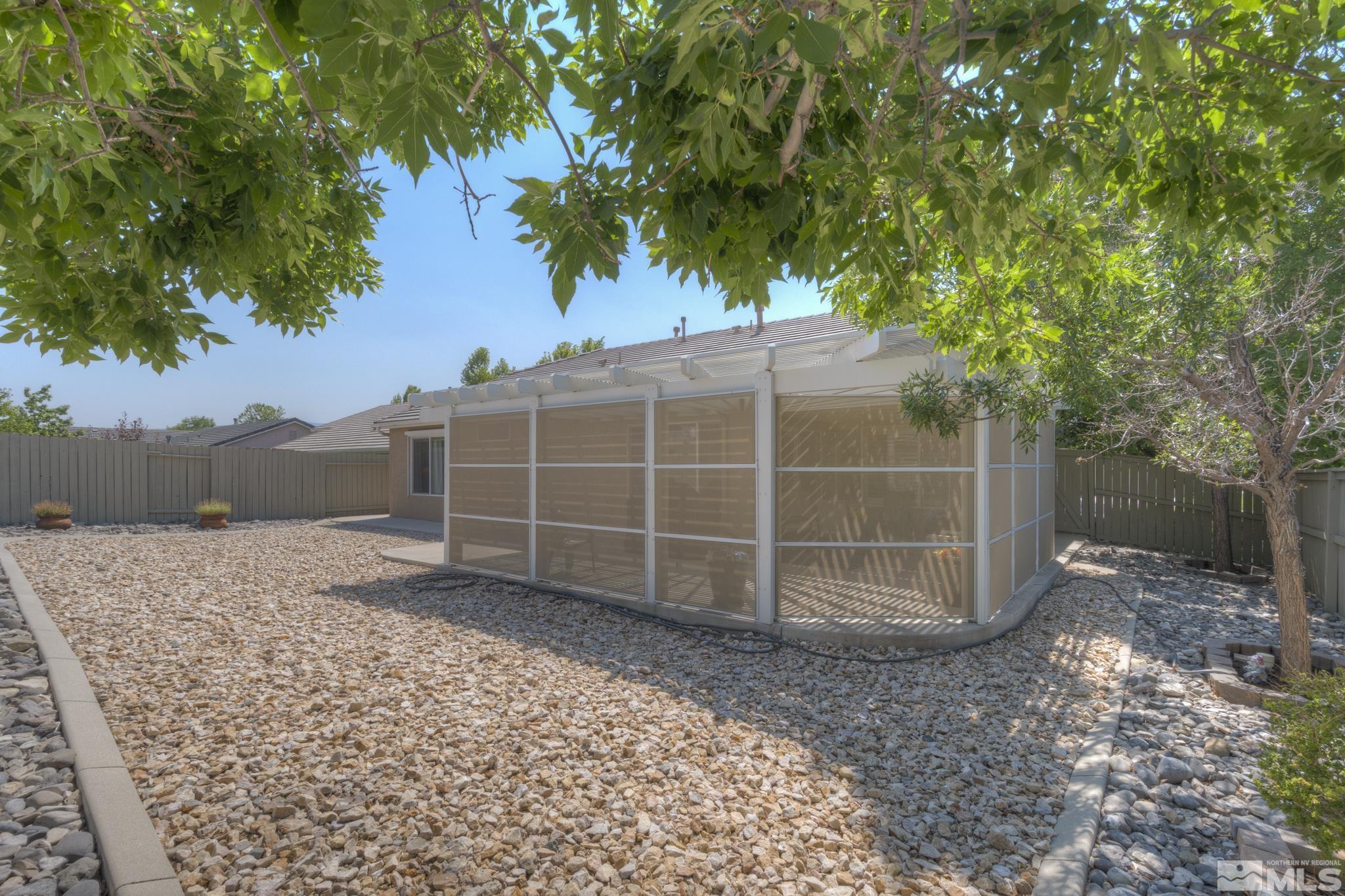 10695 Vista Bonita Lane Reno, NV 89521 - Photo 24 of 31 a view of a backyard with a tree