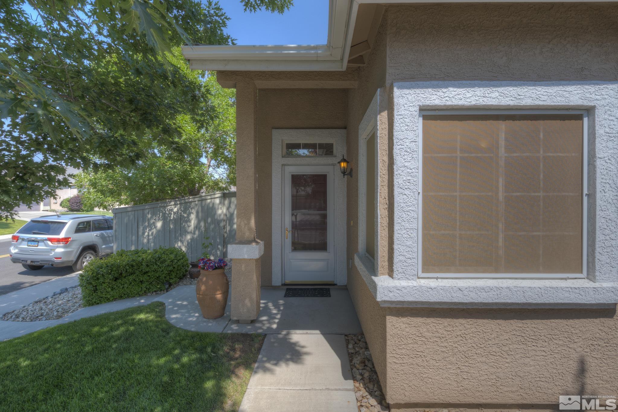 10695 Vista Bonita Lane Reno, NV 89521 - Photo 3 of 31 a front view of a house with a yard