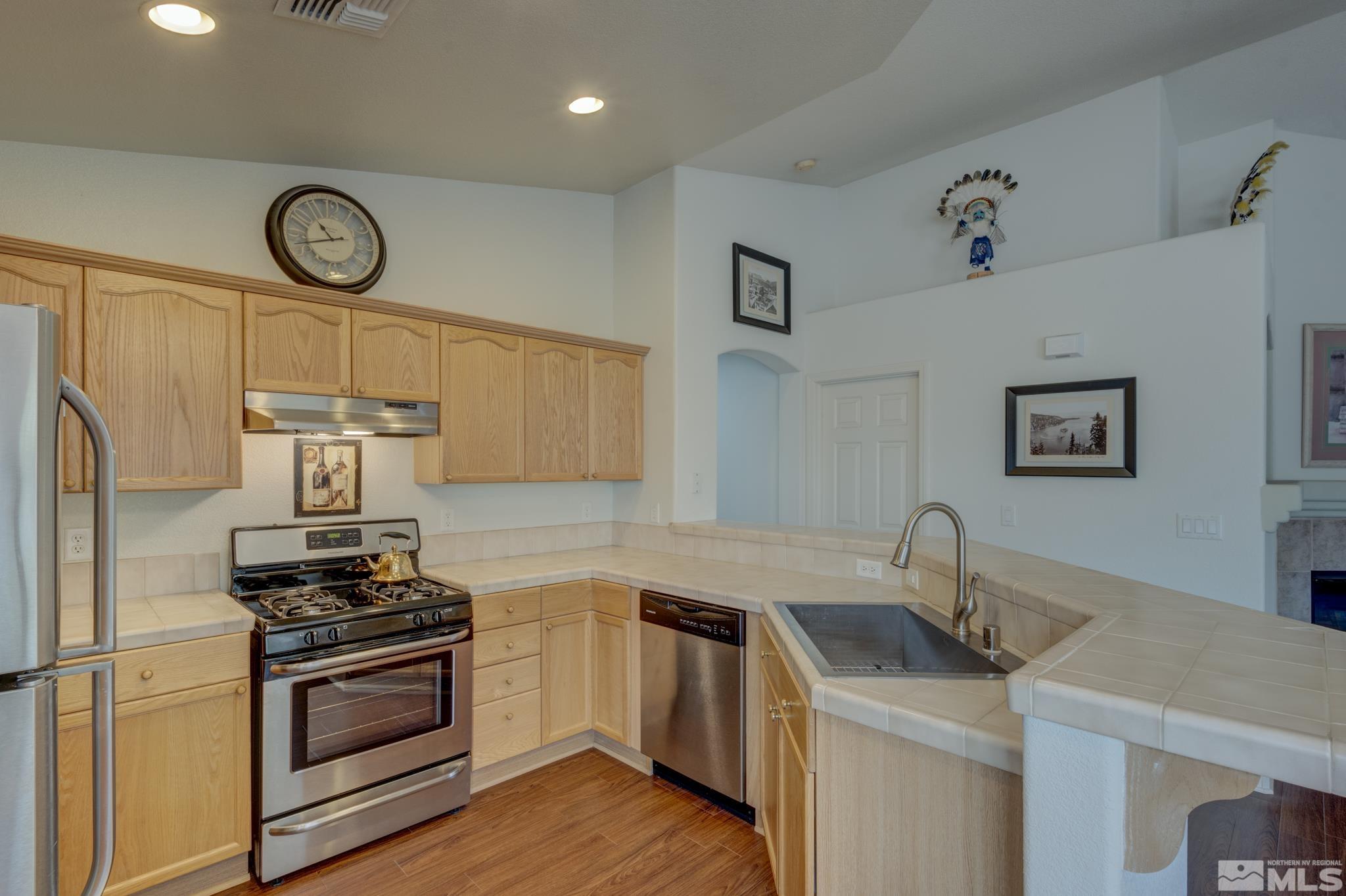 10695 Vista Bonita Lane Reno, NV 89521 - Photo 10 of 31 a kitchen with cabinets appliances and a counter top