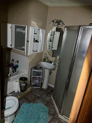 a bathroom with a toilet and a sink