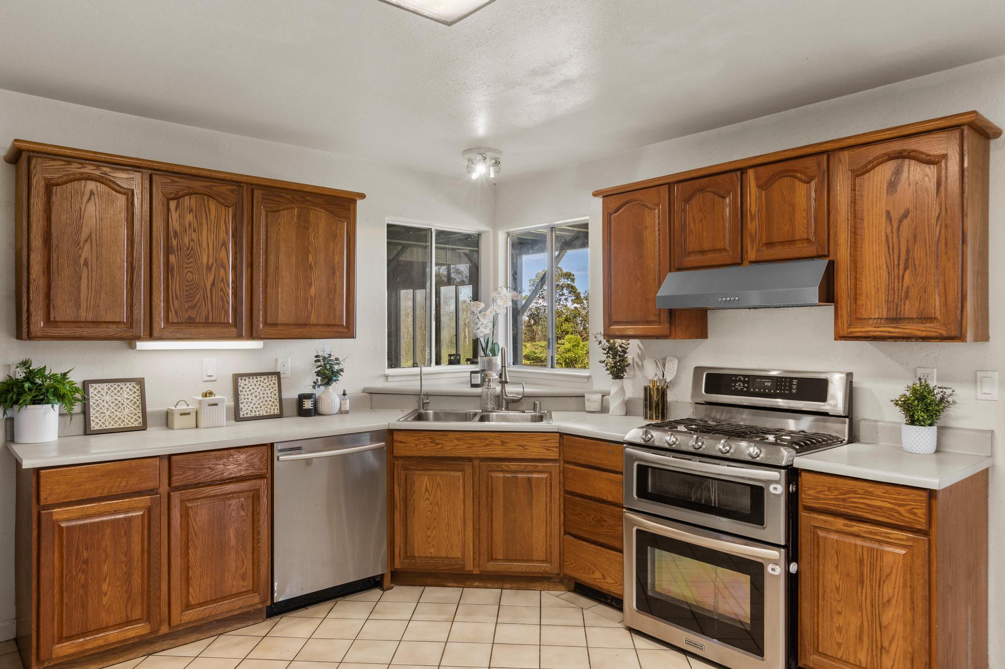 18-4565 Makaala Rd Mountain View Mountain View, HI 96771 - Photo 7 of 25 a kitchen with a sink stove top oven and cabinets
