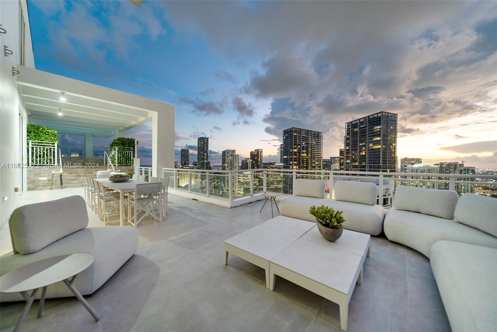900 Brickell Key Boulevard, Unit PH3401 Miami, FL 33131 - Photo 1 of 58 a living room with furniture