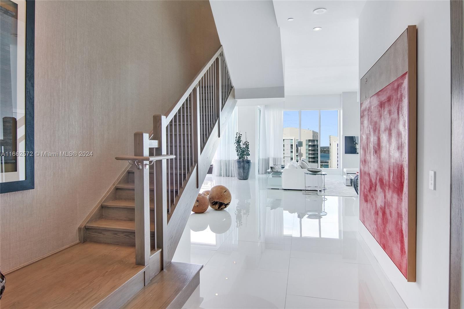 900 Brickell Key Boulevard, Unit PH3401 Miami, FL 33131 - Photo 17 of 58 a view of entryway and hall with wooden floor