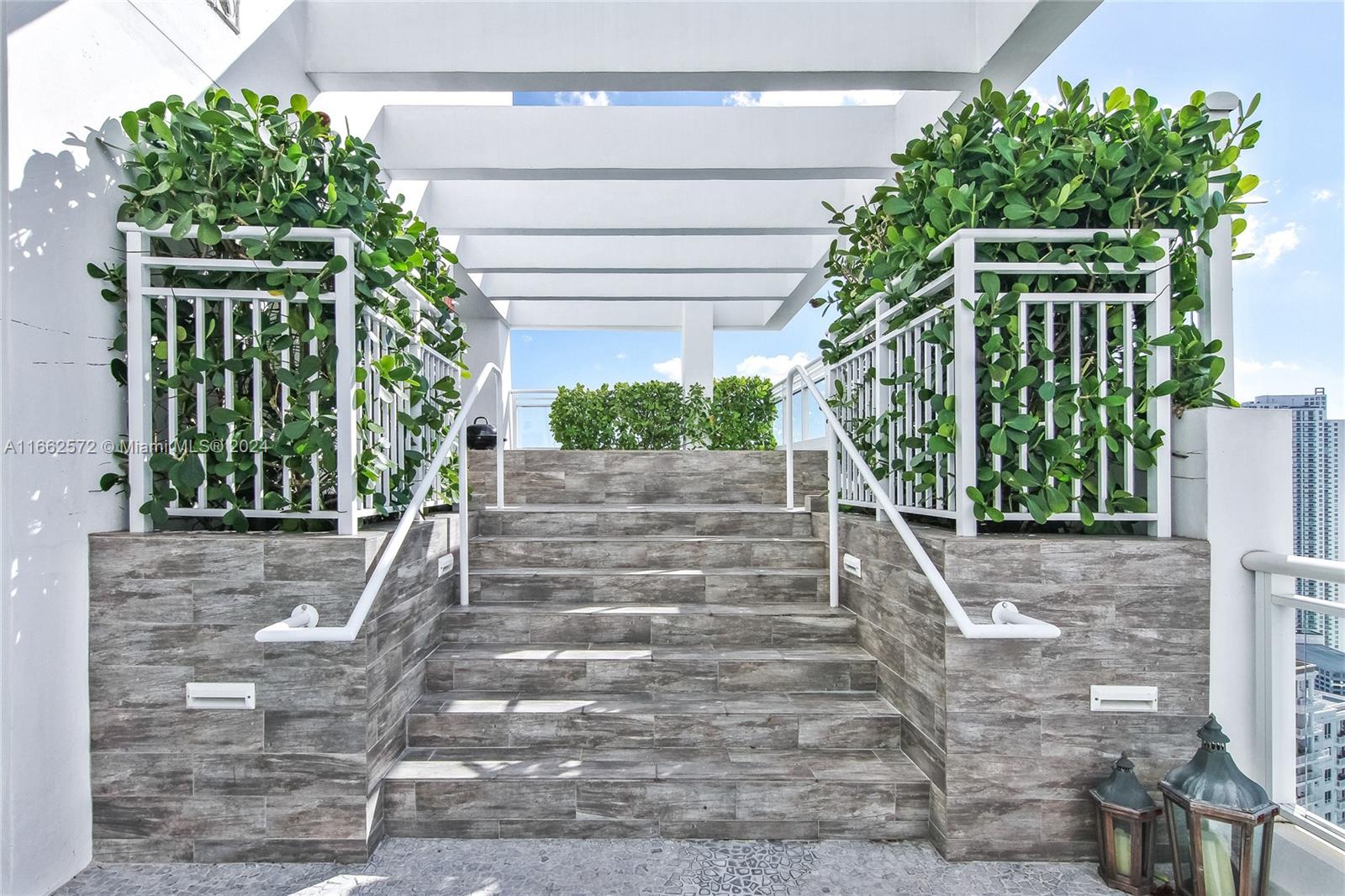900 Brickell Key Boulevard, Unit PH3401 Miami, FL 33131 - Photo 32 of 58 a view of stairs with plants