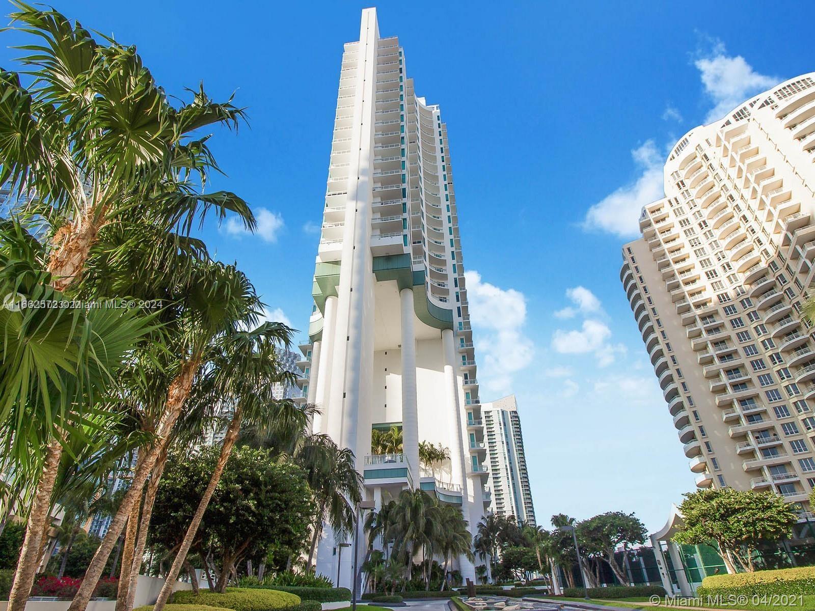900 Brickell Key Boulevard, Unit PH3401 Miami, FL 33131 - Photo 42 of 58 a front view of a multi story building
