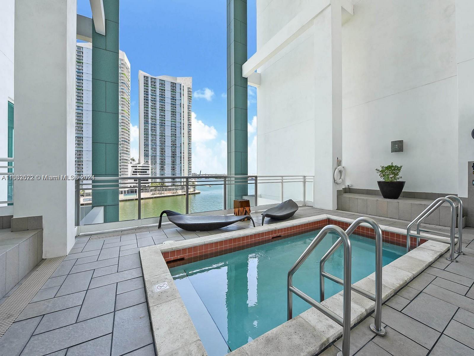 900 Brickell Key Boulevard, Unit PH3401 Miami, FL 33131 - Photo 46 of 58 a bathroom with a sink and a mirror