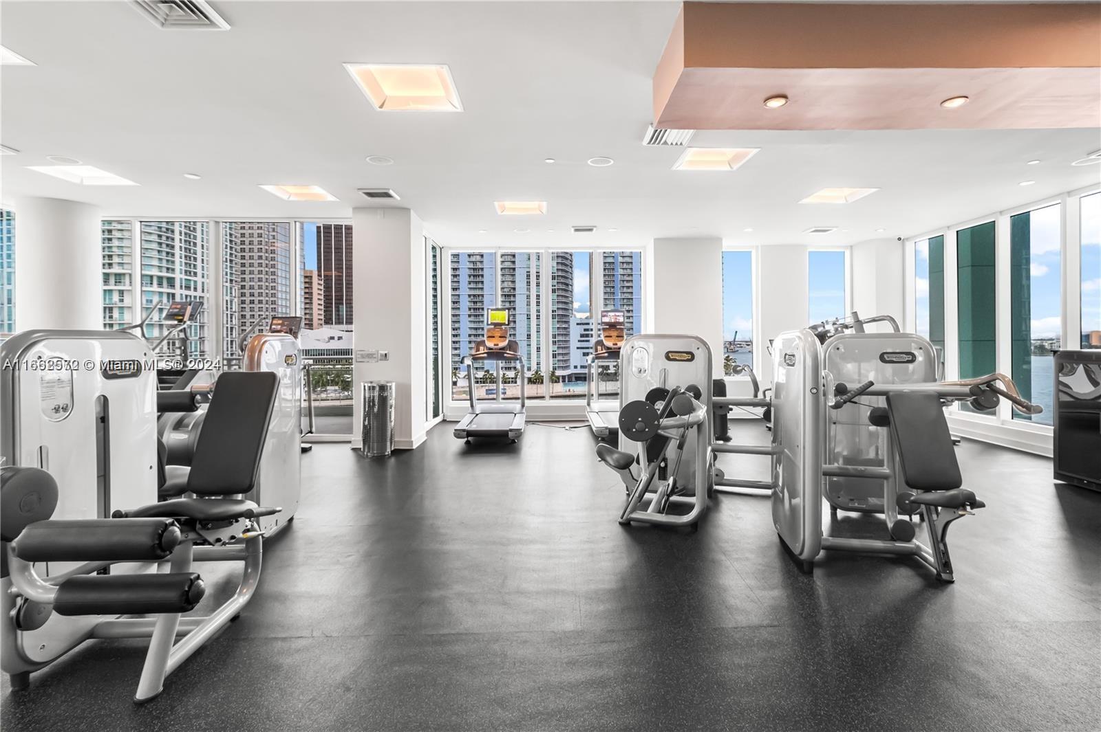 900 Brickell Key Boulevard, Unit PH3401 Miami, FL 33131 - Photo 47 of 58 a view of a room with gym equipment