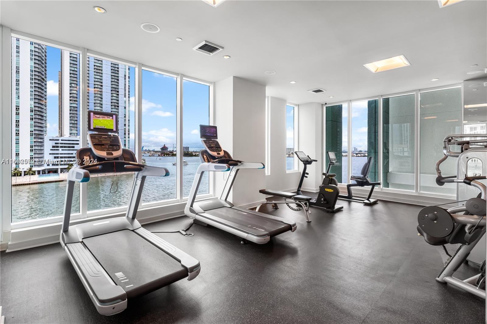 900 Brickell Key Boulevard, Unit PH3401 Miami, FL 33131 - Photo 48 of 58 a view of a room with gym equipment