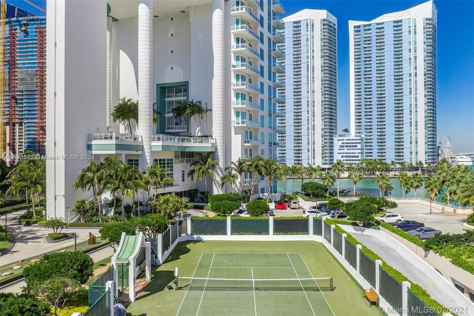 900 Brickell Key Boulevard, Unit PH3401 Miami, FL 33131 - Photo 52 of 58 a view of a balcony with chairs and potted plants