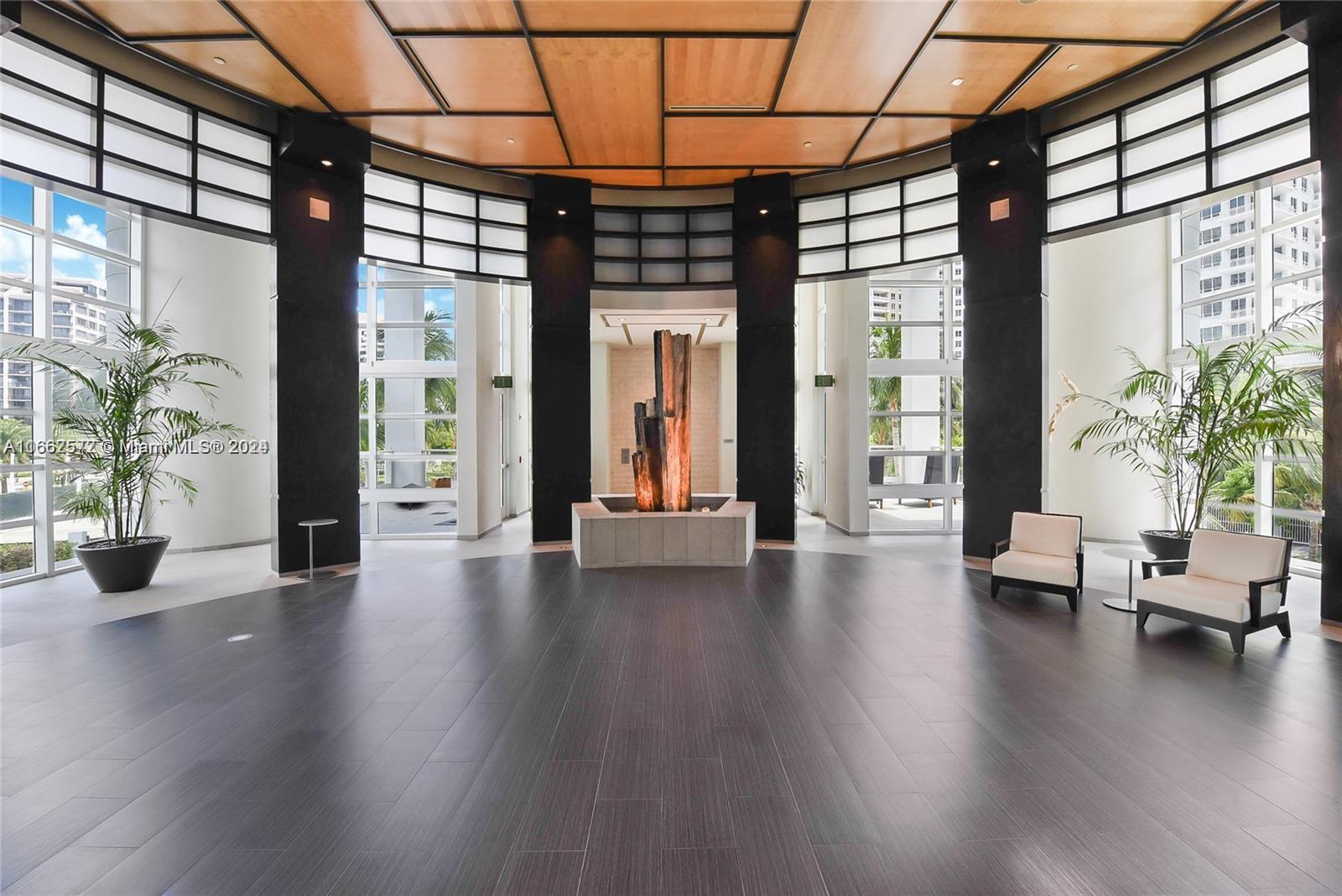 900 Brickell Key Boulevard, Unit PH3401 Miami, FL 33131 - Photo 55 of 58 wooden floor in an empty room with a window