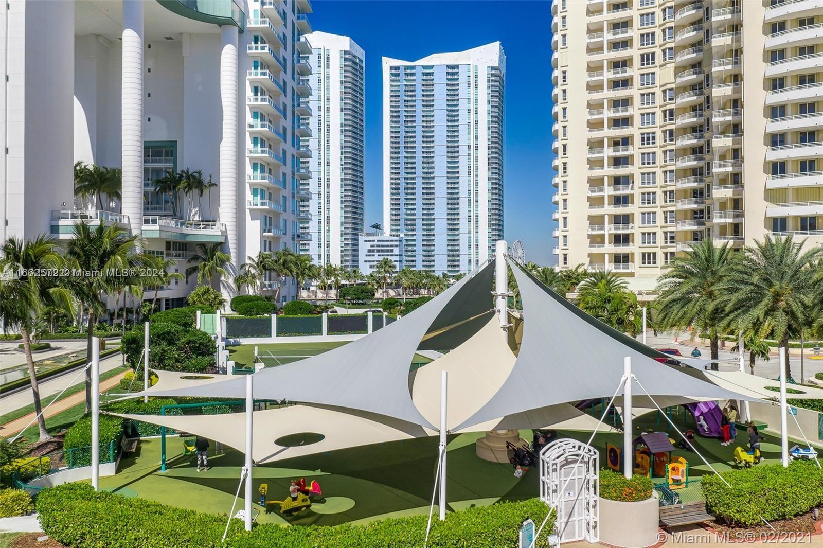 900 Brickell Key Boulevard, Unit PH3401 Miami, FL 33131 - Photo 56 of 58 a front view of a house with garden