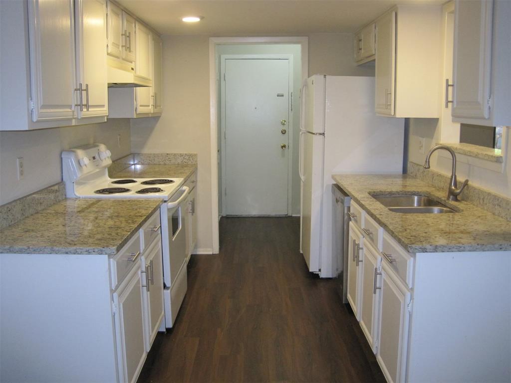 6478 Argo Street Dallas, TX 75214 - Photo 6 of 15 a kitchen with a granite countertop sink stove and refrigerator