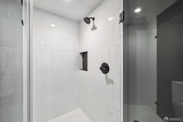 a bathroom with a shower and a shower