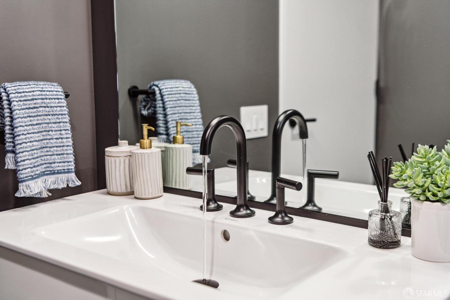 960 Market Street, Unit 808 San Francisco, CA 94102 - Photo 7 of 16 a bathroom with a sink and a potted plant