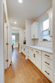 a dining room with furniture window and wooden floor