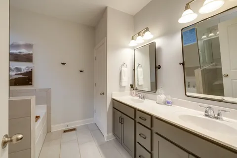 a bathroom with a bathtub and a shower