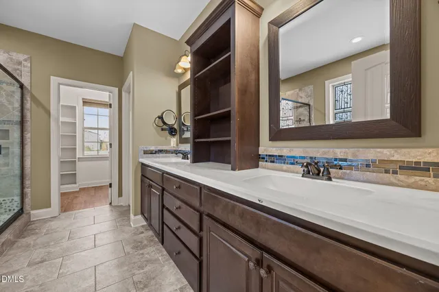 a spacious bathroom with a bathtub and a shower
