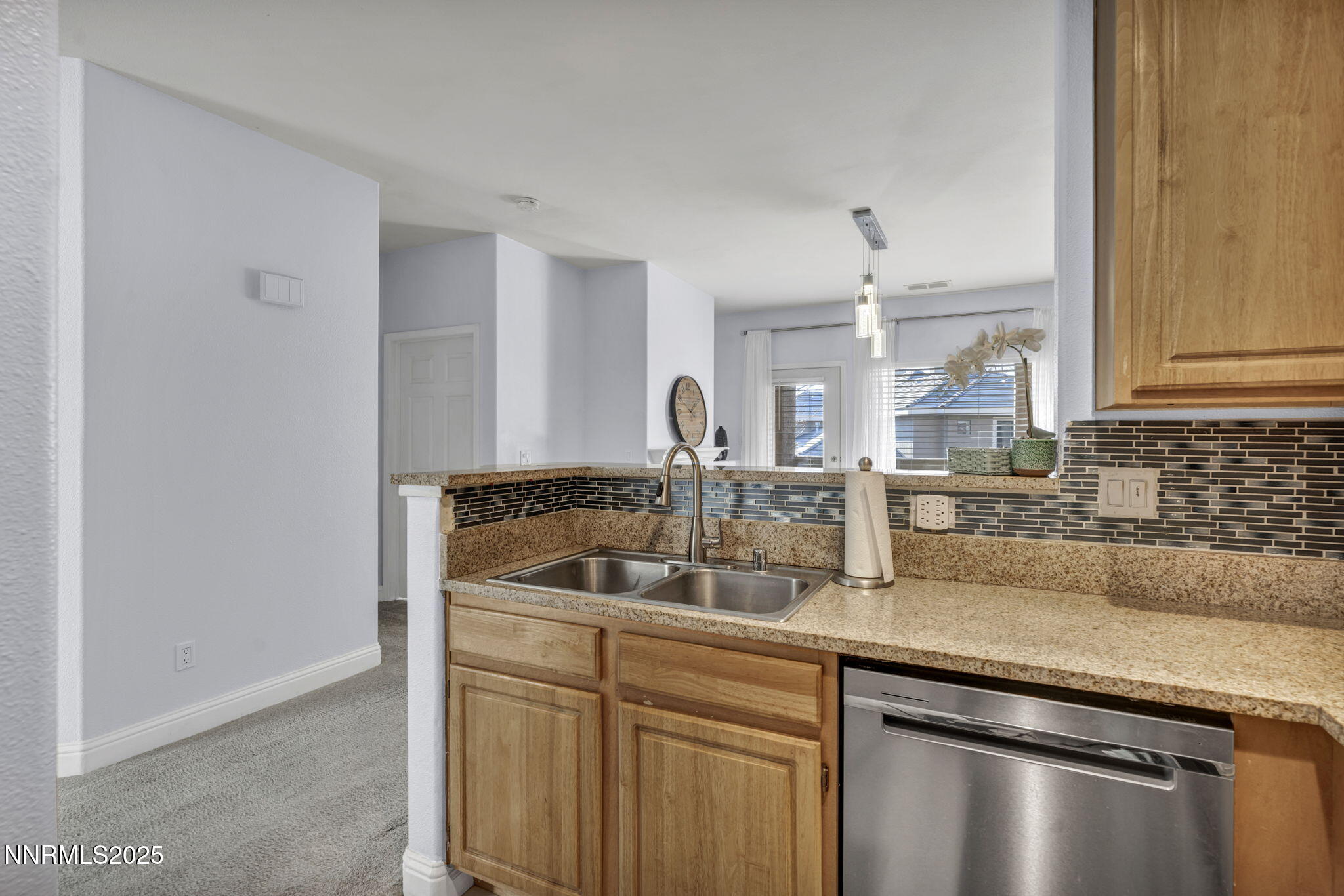900 South Meadows Parkway, Unit 3223 Reno, NV 89521 - Photo 11 of 42 a kitchen with a sink and cabinets