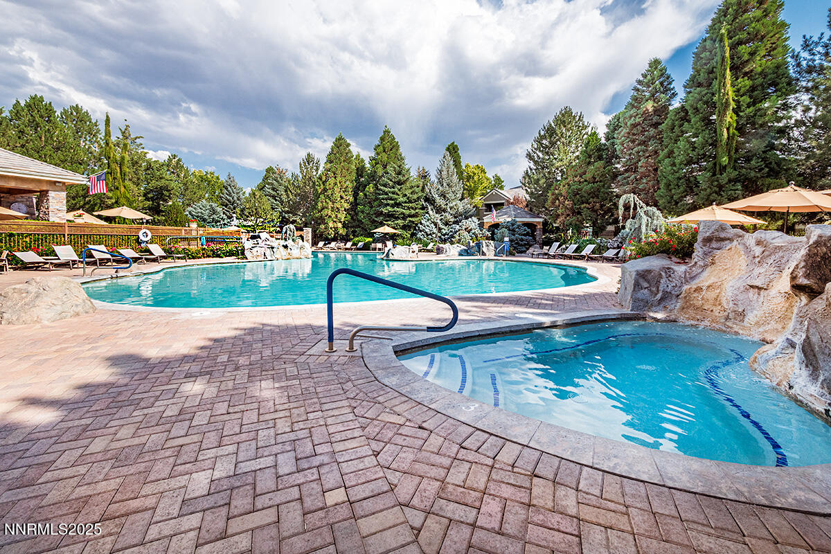 900 South Meadows Parkway, Unit 3223 Reno, NV 89521 - Photo 30 of 42 a view of a swimming pool with a patio