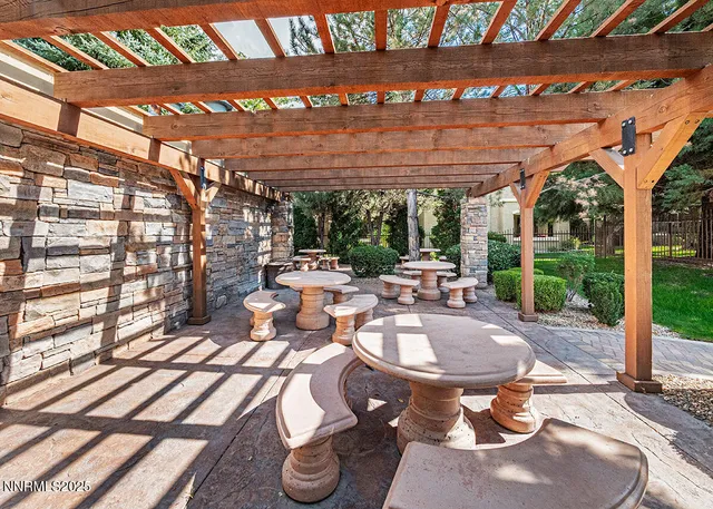 a living room with furniture flat screen tv and outdoor view
