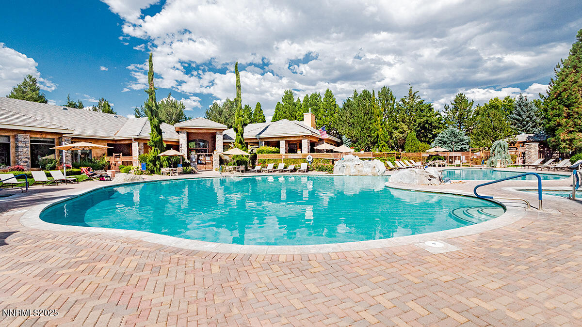 900 South Meadows Parkway, Unit 3223 Reno, NV 89521 - Photo 4 of 42 a view of a swimming pool with a garden and plants