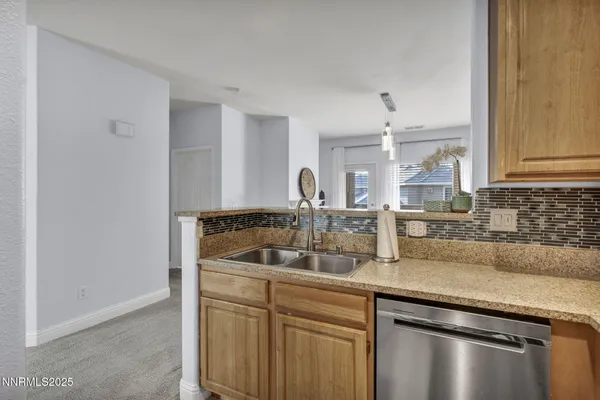 a living room with lots of furniture and a large window