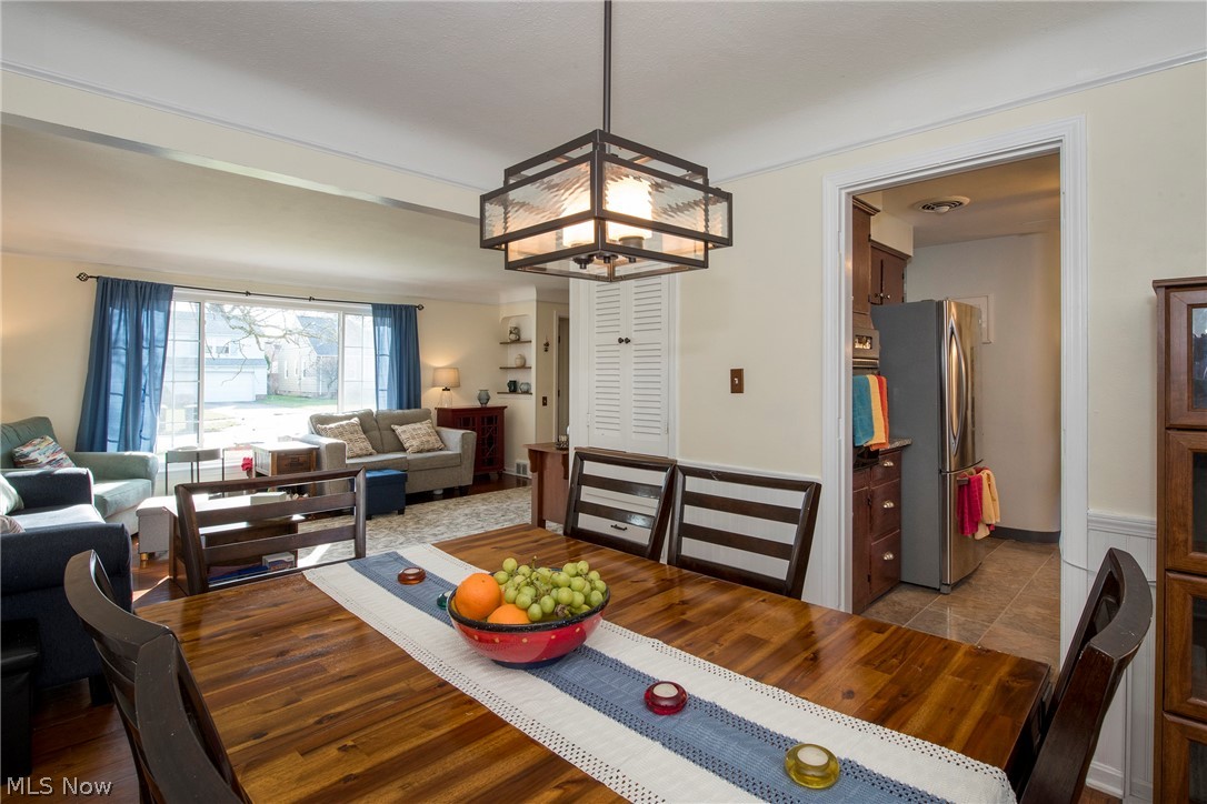1170 Roland Road Lyndhurst, OH 44124 - Photo 5 of 36 Dining room featuring a chandelier and tile floors