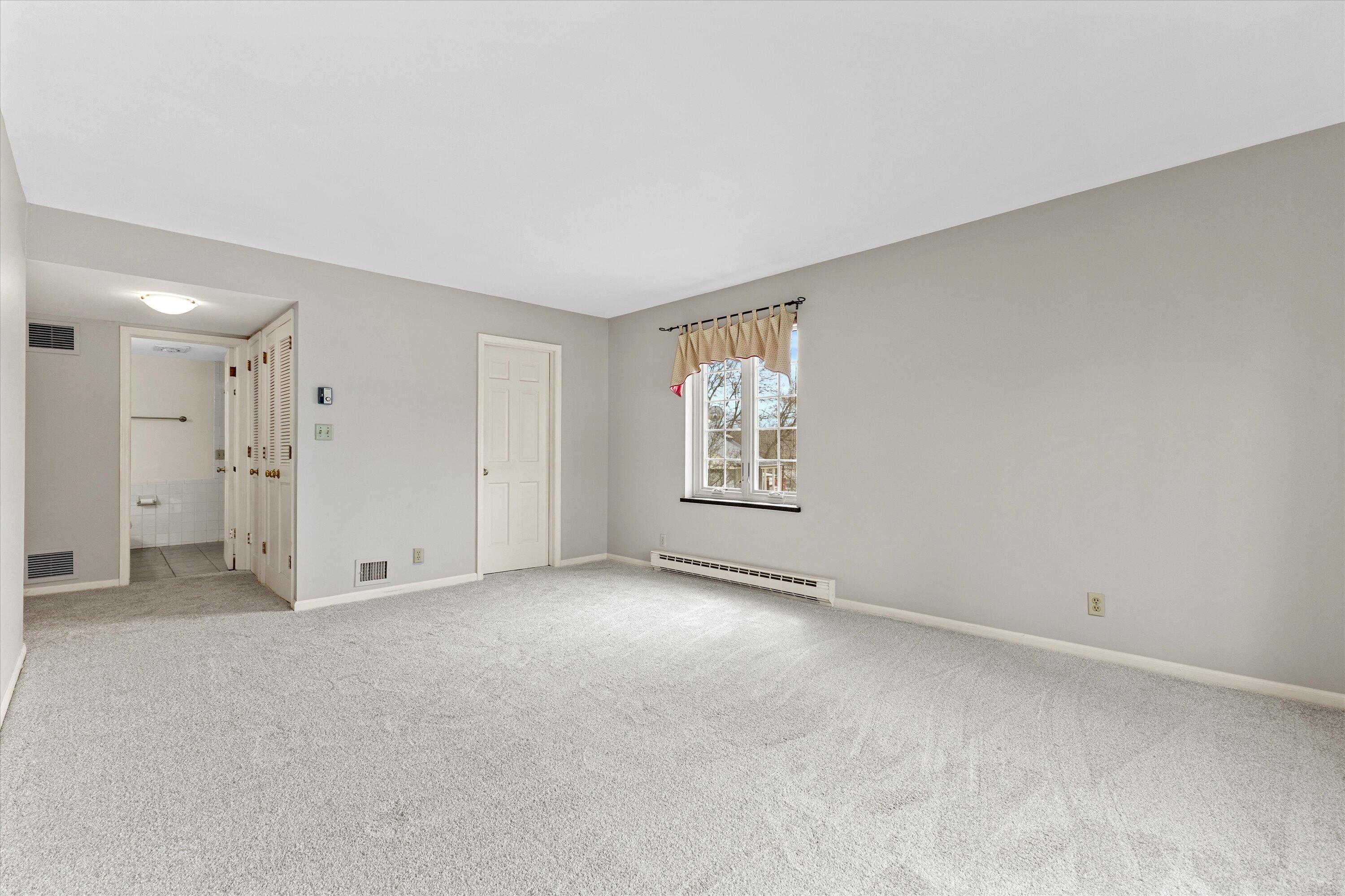 13335 Watertown Plank Road, Unit 105 Elm Grove, WI 53122 - Photo 13 of 37 Primary Bedroom