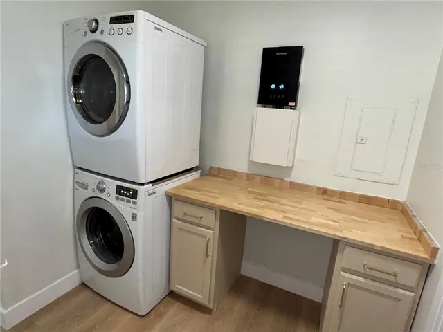 a view of a kitchen with a sink and a window