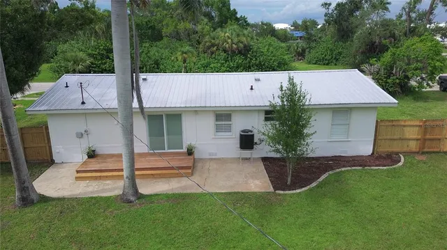 a view of a backyard with a garden and plants