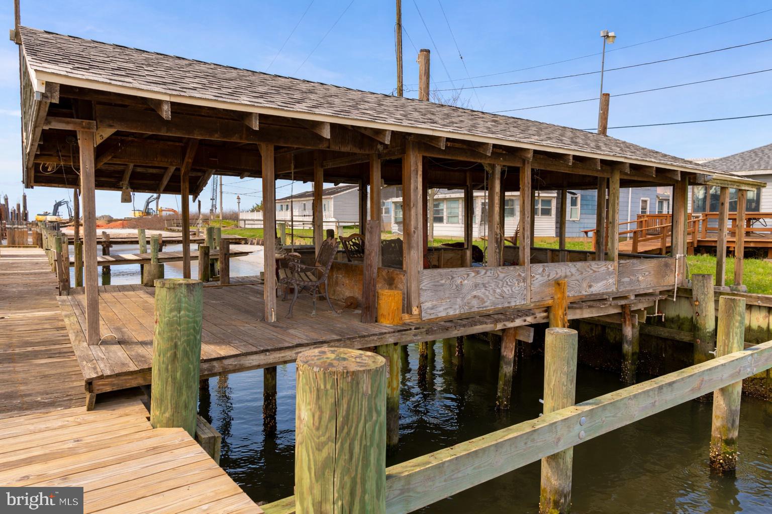 4404 South Bowers Road Milford, DE 19963 - Photo 12 of 53 a front view of a house with outdoor seating