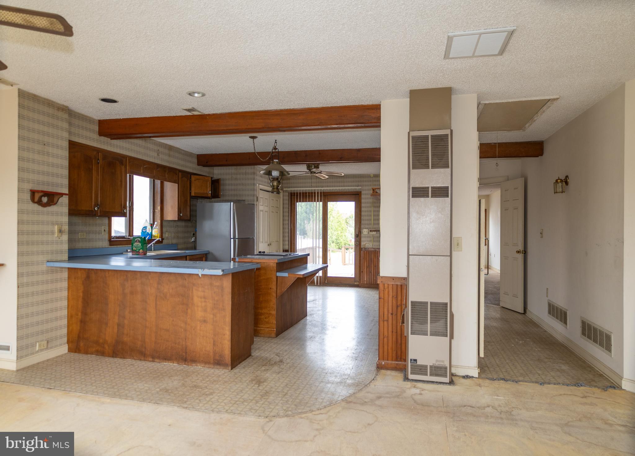 4404 South Bowers Road Milford, DE 19963 - Photo 21 of 53 a kitchen with stainless steel appliances kitchen island granite countertop a refrigerator and cabinets