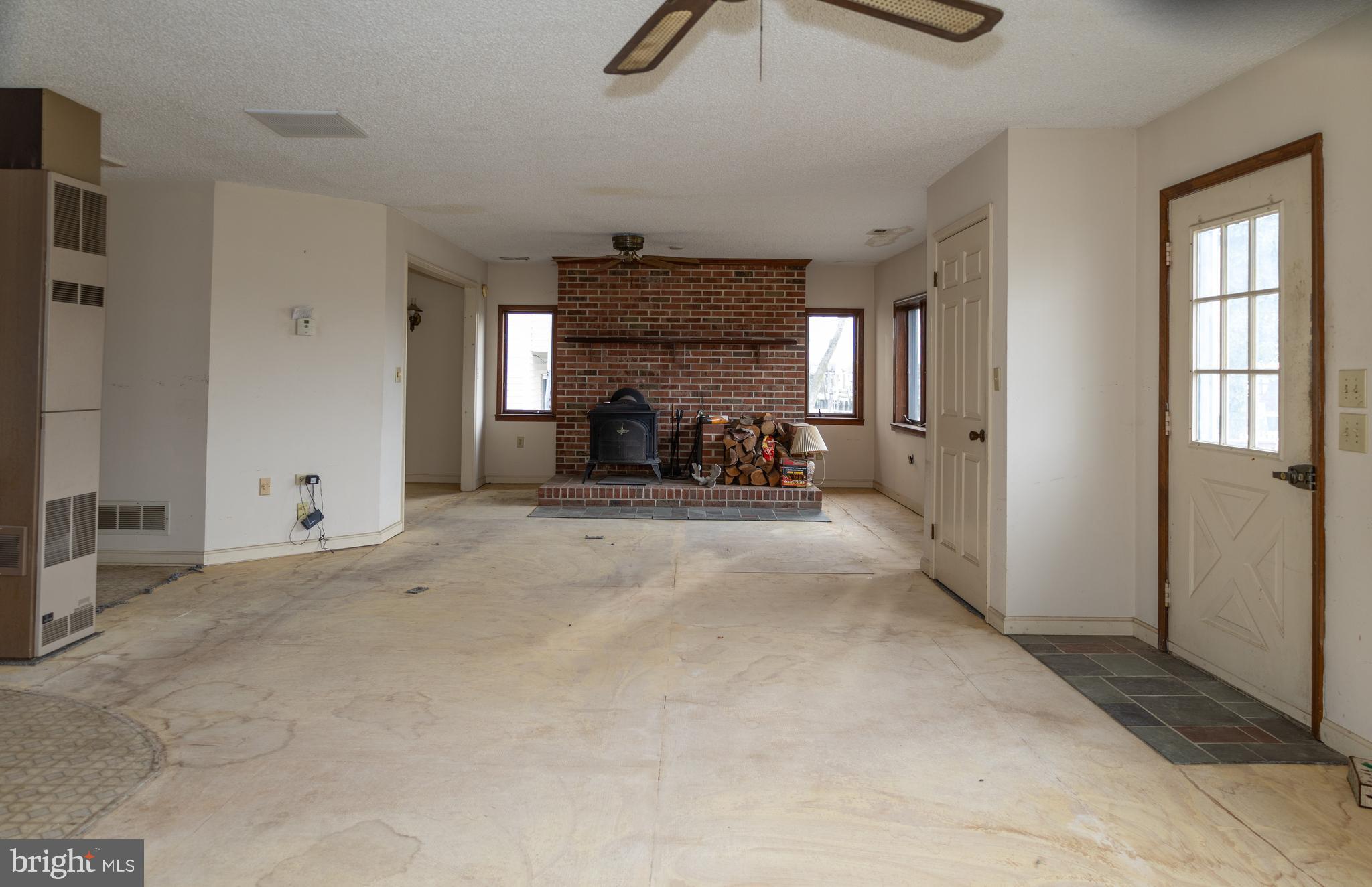4404 South Bowers Road Milford, DE 19963 - Photo 24 of 53 a view of a livingroom with furniture and a ceiling fan