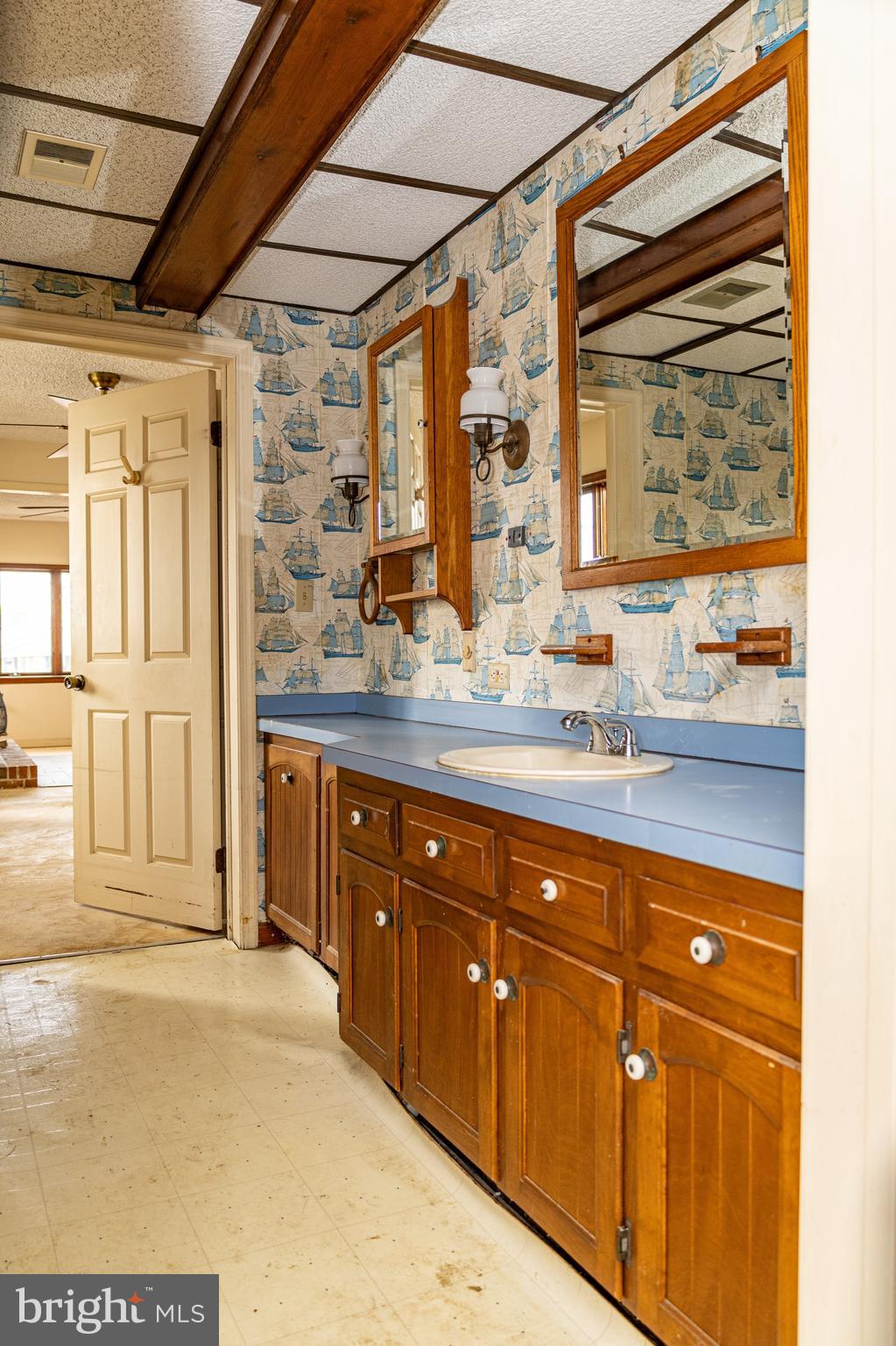 4404 South Bowers Road Milford, DE 19963 - Photo 31 of 53 a bathroom with a granite countertop sink mirror and