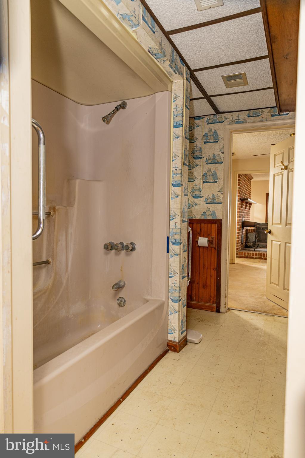 4404 South Bowers Road Milford, DE 19963 - Photo 32 of 53 a bathroom with a bathtub and a shower