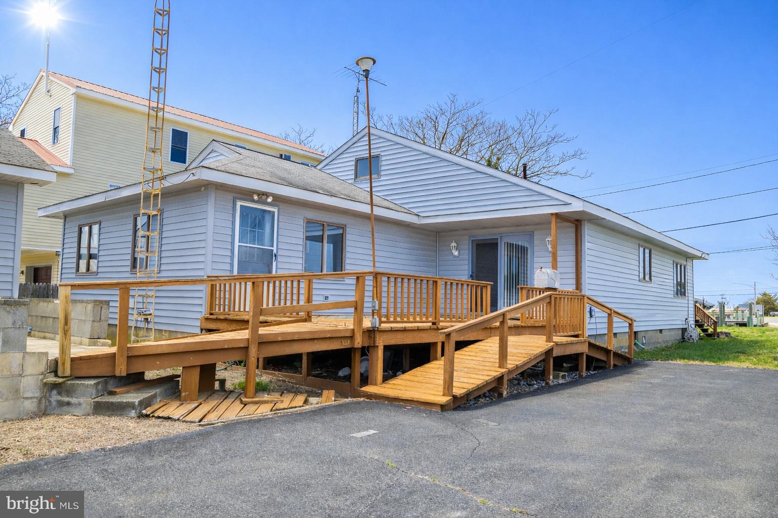 4404 South Bowers Road Milford, DE 19963 - Photo 4 of 53 a view of a house with backyard and sitting area