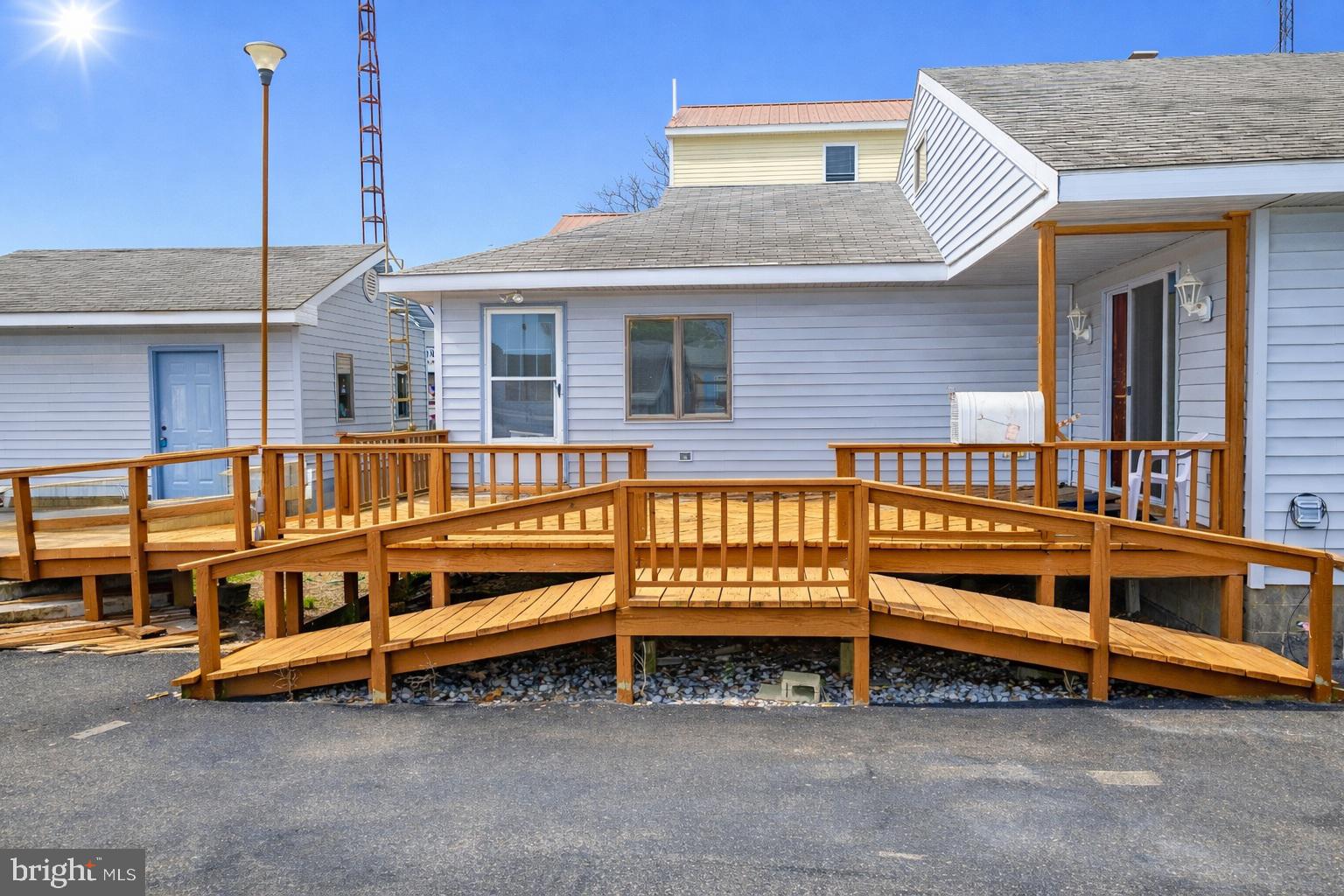 4404 South Bowers Road Milford, DE 19963 - Photo 5 of 53 a view of a house with a large window and a table