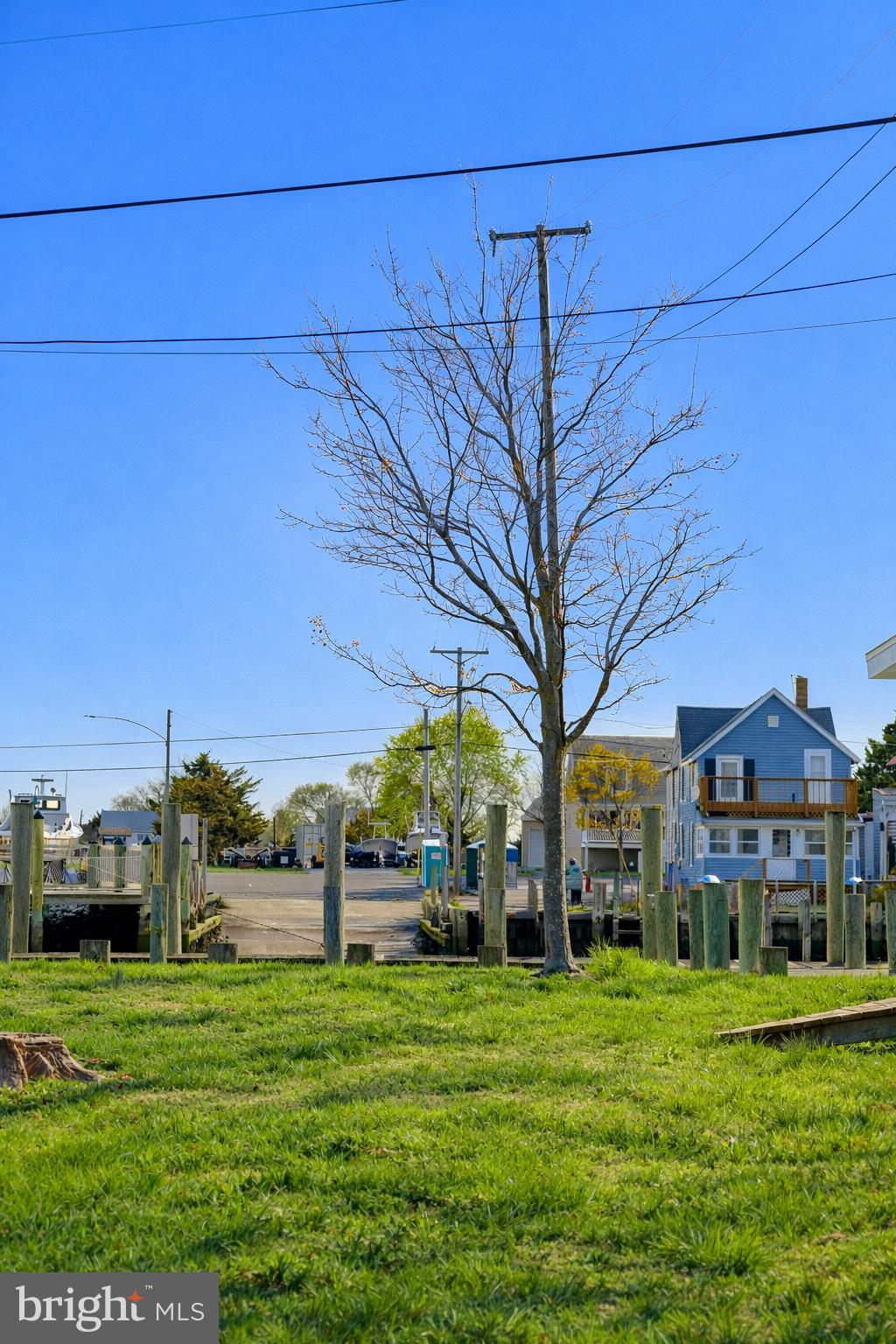 4404 South Bowers Road Milford, DE 19963 - Photo 53 of 53 a view of a big house with a big yard and large trees