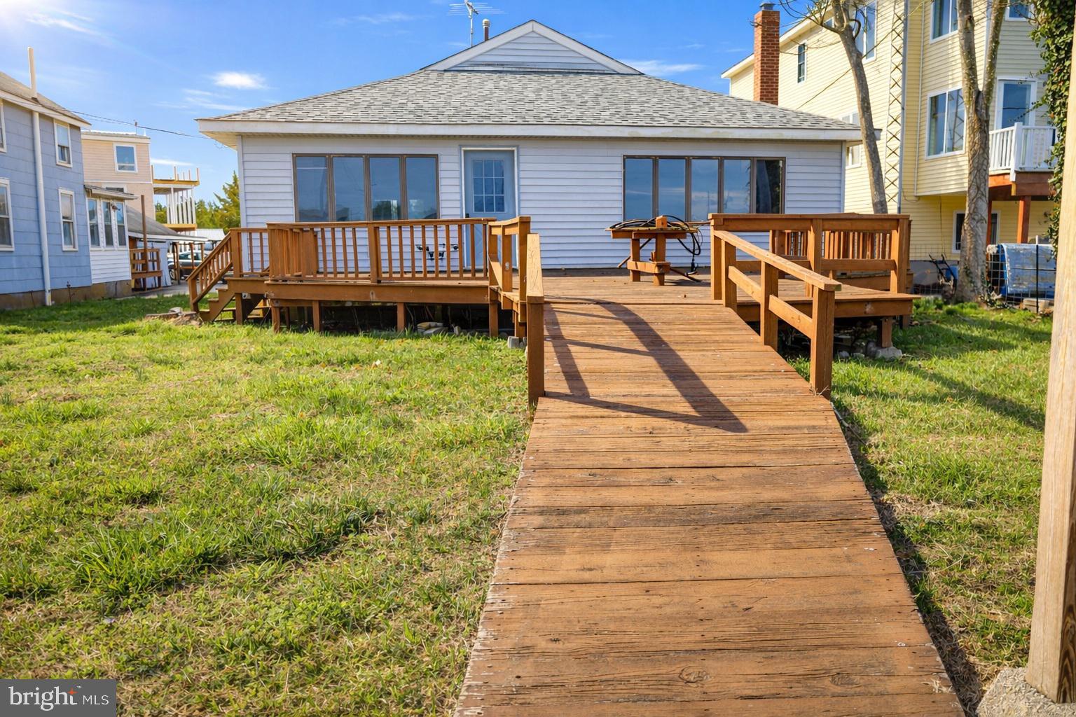 4404 South Bowers Road Milford, DE 19963 - Photo 10 of 53 a front view of a house with a yard table and chairs